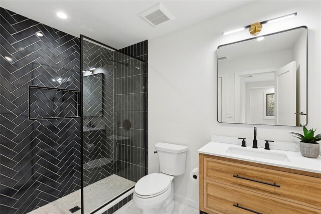 10 Lenape Rd, Southampton, NY 11968 - full bath featuring vanity, toilet, and a tile shower