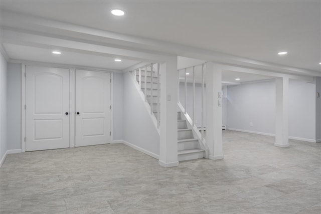 7 Searington Dr, Syosset, NY 11791 - finished below grade area with stairway, recessed lighting, baseboards, and light marble finish floors