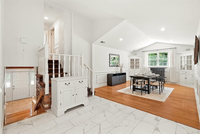 125 Park Ln, West Harrison, NY 10604 - dining space with stairway, lofted ceiling, light marble finish flooring, and recessed lighting