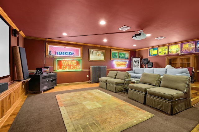 125 Park Ln, West Harrison, NY 10604 - carpeted cinema featuring radiator heating unit, recessed lighting, and ornamental molding
