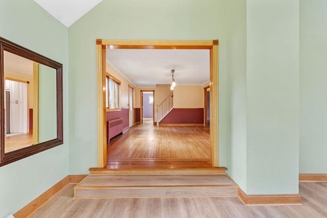 4 W Burda Pl, New City, NY 10956 - hallway featuring radiator heating unit, wood finished floors, stairway, and baseboards