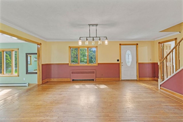 4 W Burda Pl, New City, NY 10956 - foyer entrance featuring radiator heating unit, a baseboard heating unit, hardwood / wood-style floors, stairway, and baseboards