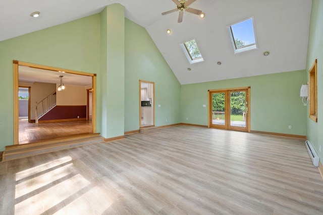 4 W Burda Pl, New City, NY 10956 - unfurnished living room featuring high vaulted ceiling, a baseboard radiator, wood finished floors, baseboards, and recessed lighting