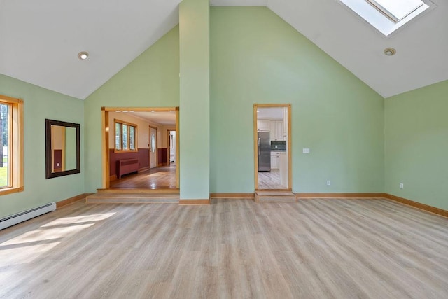 4 W Burda Pl, New City, NY 10956 - unfurnished living room featuring high vaulted ceiling, a skylight, radiator, light wood-type flooring, and baseboards