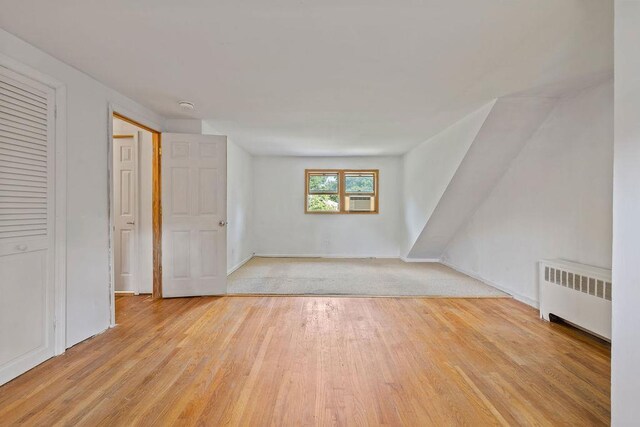 4 W Burda Pl, New City, NY 10956 - unfurnished living room featuring radiator, light wood finished floors, and baseboards