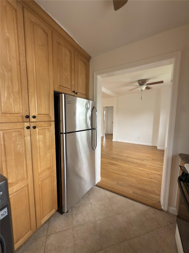 240 Halstead Ave Unit C8, Harrison, NY 10528 - kitchen with freestanding refrigerator, a ceiling fan, stove, and light tile patterned flooring