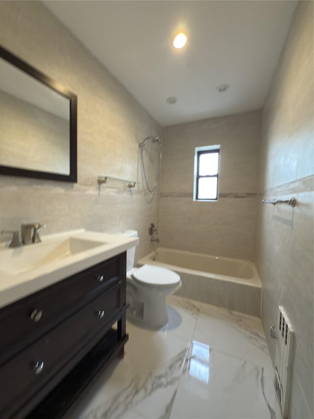 240 Halstead Ave Unit C8, Harrison, NY 10528 - full bath featuring radiator, vanity, toilet, tile walls, and marble finish flooring