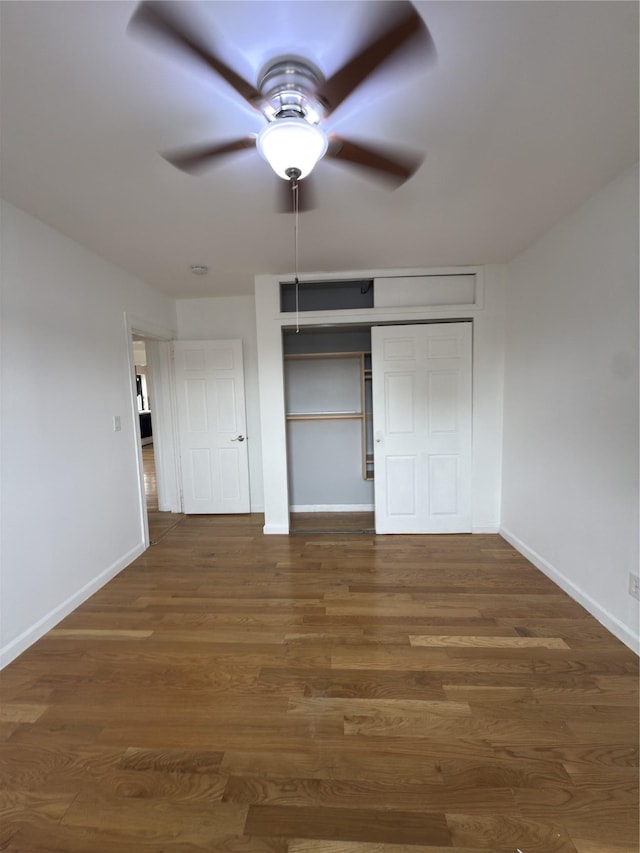 240 Halstead Ave Unit C8, Harrison, NY 10528 - unfurnished bedroom featuring baseboards, wood finished floors, ceiling fan, and a closet
