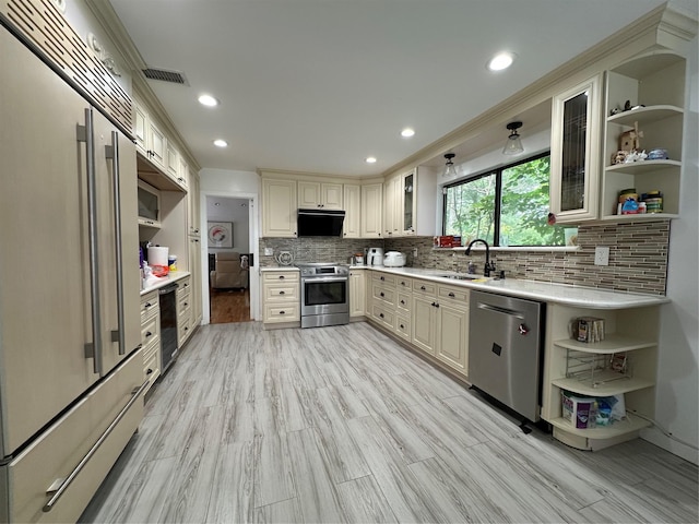 12 Yale Dr, Manhasset, NY 11030 - kitchen featuring open shelves, appliances with stainless steel finishes, a sink, exhaust hood, and light countertops