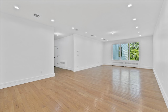 244 Blauvelt Rd Unit 213, Monsey, NY 10952 - empty room with light wood-type flooring, radiator, and recessed lighting
