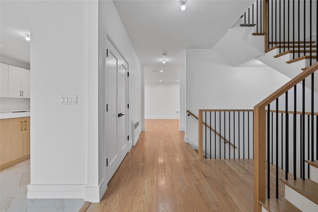244 Blauvelt Rd Unit 213, Monsey, NY 10952 - hallway with an upstairs landing and light wood-style flooring