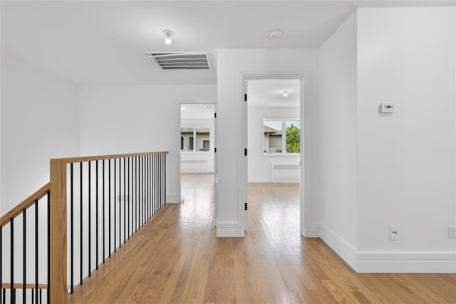 244 Blauvelt Rd Unit 213, Monsey, NY 10952 - corridor featuring radiator heating unit and light wood-type flooring