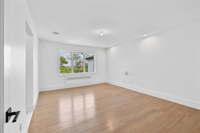 244 Blauvelt Rd Unit 213, Monsey, NY 10952 - empty room featuring radiator heating unit and light wood-style flooring