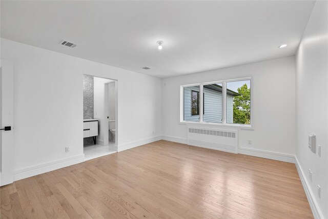 244 Blauvelt Rd Unit 213, Monsey, NY 10952 - empty room featuring radiator heating unit and light wood-type flooring