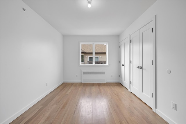 244 Blauvelt Rd Unit 213, Monsey, NY 10952 - unfurnished bedroom with radiator and light wood finished floors