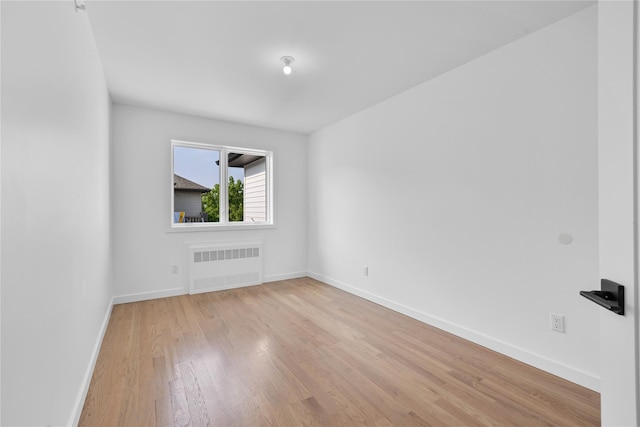 244 Blauvelt Rd Unit 213, Monsey, NY 10952 - unfurnished room with radiator heating unit and wood finished floors