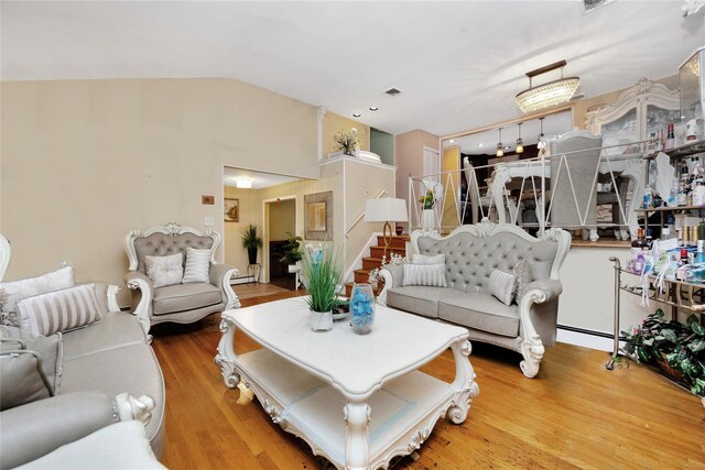 32 Cedar St, Lindenhurst, NY 11757 - living area featuring wood finished floors and lofted ceiling