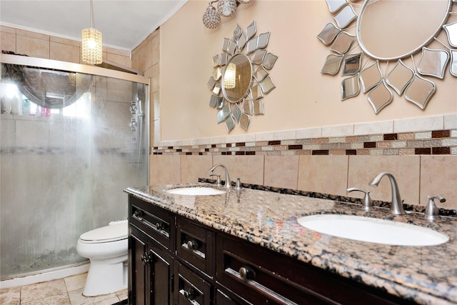 32 Cedar St, Lindenhurst, NY 11757 - full bathroom featuring a shower stall, toilet, tile walls, double vanity, and tile patterned flooring