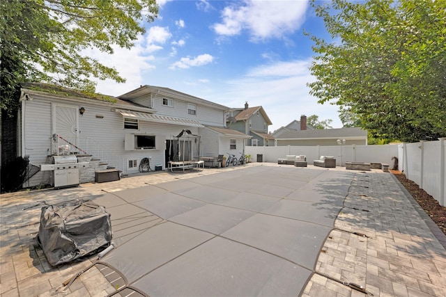 32 Cedar St, Lindenhurst, NY 11757 - back of property with a patio and a fenced backyard