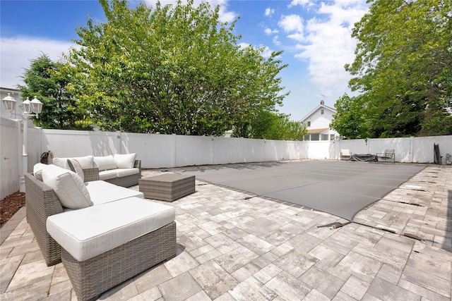 32 Cedar St, Lindenhurst, NY 11757 - fenced backyard featuring a patio area and outdoor lounge area