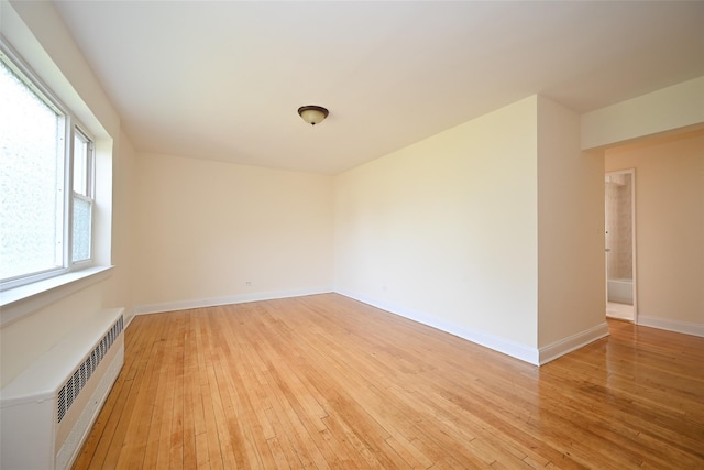 20-21 Parsons Blvd, Whitestone, NY 11357 - spare room featuring radiator and light wood-type flooring