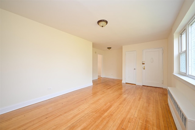 20-21 Parsons Blvd, Whitestone, NY 11357 - unfurnished room featuring light wood-style flooring and radiator