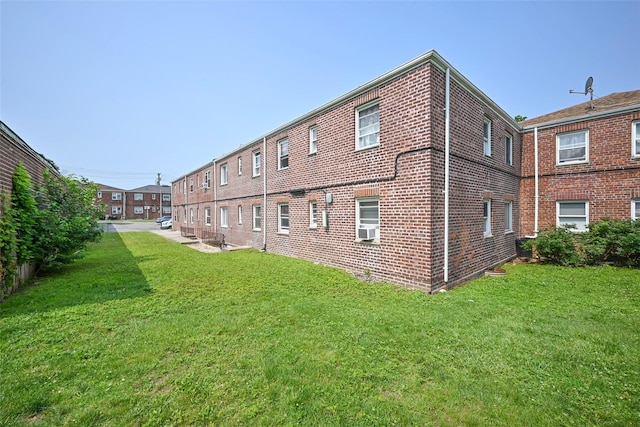 20-21 Parsons Blvd, Whitestone, NY 11357 - back of house with a yard, brick siding, and cooling unit