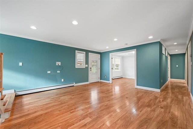 513 3rd St, Newburgh, NY 12550 - unfurnished living room featuring a baseboard radiator, baseboard heating, ornamental molding, recessed lighting, and light wood-style flooring
