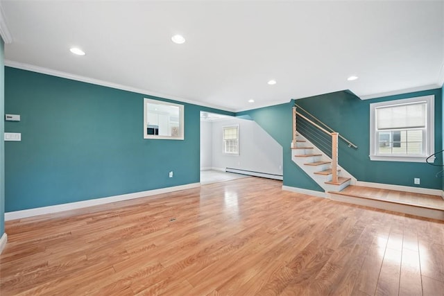 513 3rd St, Newburgh, NY 12550 - spare room with a baseboard heating unit, ornamental molding, stairs, wood finished floors, and recessed lighting