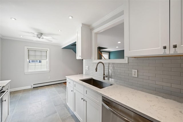 513 3rd St, Newburgh, NY 12550 - kitchen featuring crown molding, a baseboard heating unit, dishwasher, light stone counters, and decorative backsplash