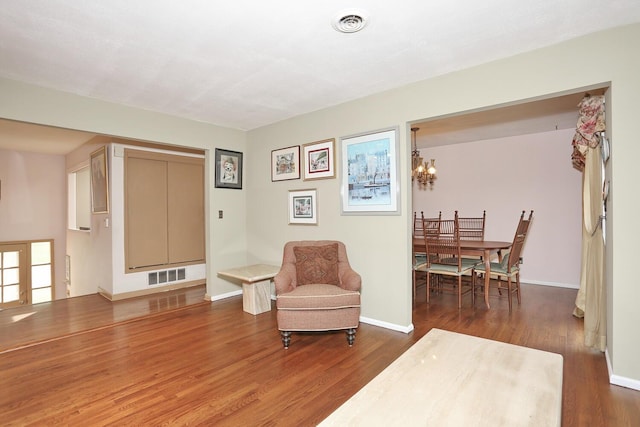 11 Claremont Ln, Suffern, NY 10901 - sitting room with wood finished floors and a chandelier