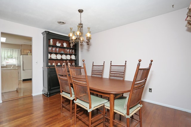 11 Claremont Ln, Suffern, NY 10901 - dining room with a chandelier and wood finished floors
