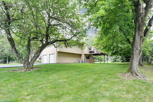 11 Claremont Ln, Suffern, NY 10901 - view of green lawn featuring a deck and an attached garage