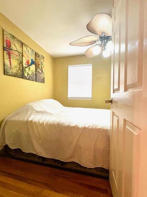 148 Bch 97th St, Rockaway Beach, NY 11693 - bedroom with wood finished floors and ceiling fan