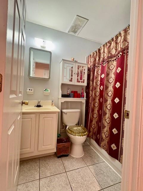 148 Bch 97th St, Rockaway Beach, NY 11693 - full bath with toilet, vanity, tile patterned floors, and a shower with shower curtain