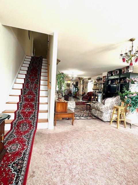 148 Bch 97th St, Rockaway Beach, NY 11693 - living area with stairs and carpet floors