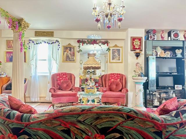 148 Bch 97th St, Rockaway Beach, NY 11693 - living area featuring a chandelier