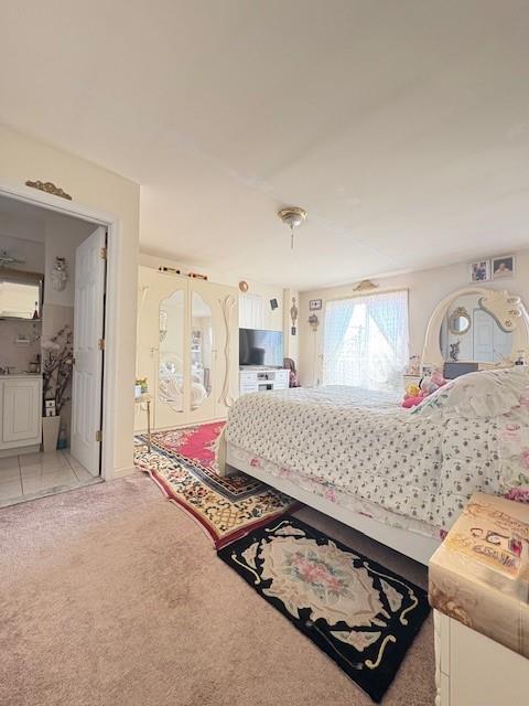 148 Bch 97th St, Rockaway Beach, NY 11693 - bedroom with light carpet