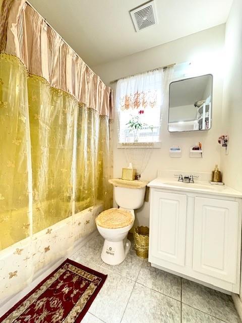 148 Bch 97th St, Rockaway Beach, NY 11693 - full bathroom with toilet, shower / bath combo with shower curtain, vanity, and tile patterned floors