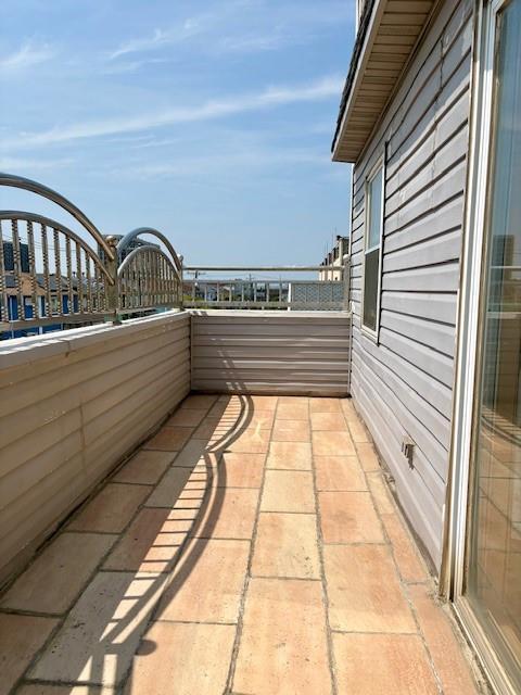 148 Bch 97th St, Rockaway Beach, NY 11693 - view of patio with a balcony