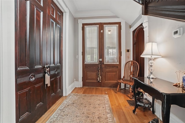 25 Garfield Pl, Poughkeepsie, NY 12601 - entrance foyer featuring light wood finished floors, french doors, crown molding, and baseboards