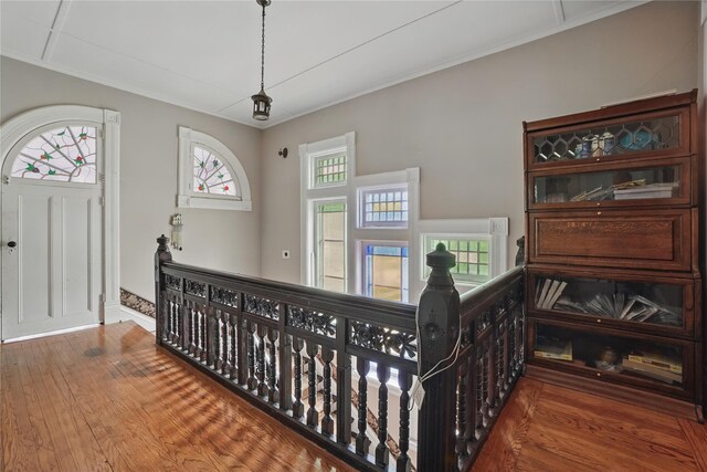 25 Garfield Pl, Poughkeepsie, NY 12601 - corridor with an upstairs landing, healthy amount of natural light, ornamental molding, wood finished floors, and baseboards