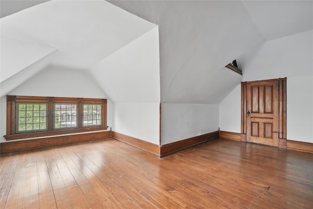 25 Garfield Pl, Poughkeepsie, NY 12601 - bonus room with lofted ceiling, wood-type flooring, and baseboards