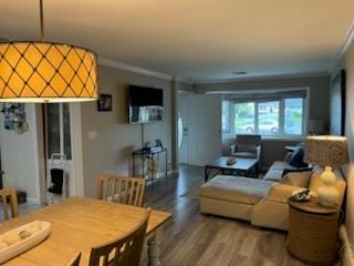 738 Craft Ave, Franklin Square, NY 11010 - living area featuring crown molding and wood finished floors
