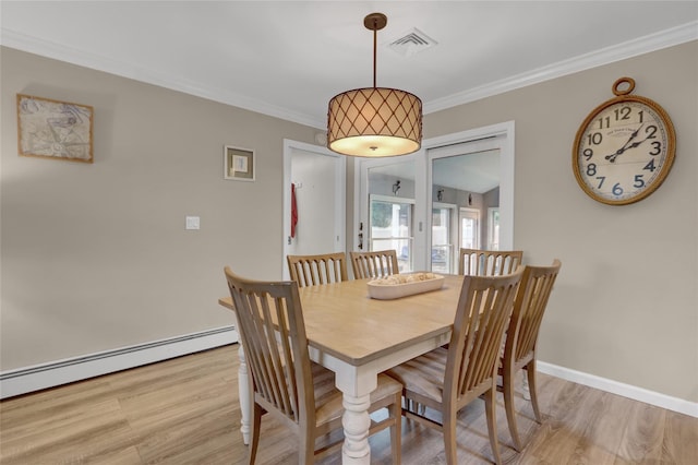 738 Craft Ave, Franklin Square, NY 11010 - dining room featuring light wood finished floors, a baseboard heating unit, and crown molding
