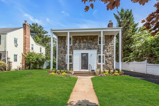 46 Beatrice Ct, Hempstead, NY 11550 - view of front of home featuring stone siding and a chimney