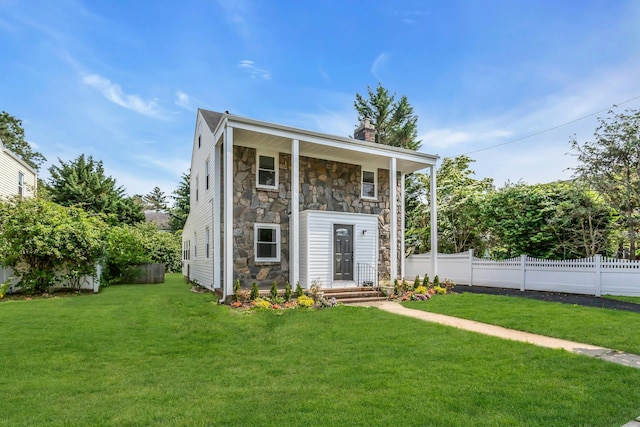 46 Beatrice Ct, Hempstead, NY 11550 - view of front of home with stone siding and a chimney
