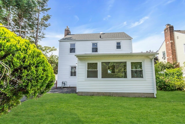 46 Beatrice Ct, Hempstead, NY 11550 - rear view of house with a lawn