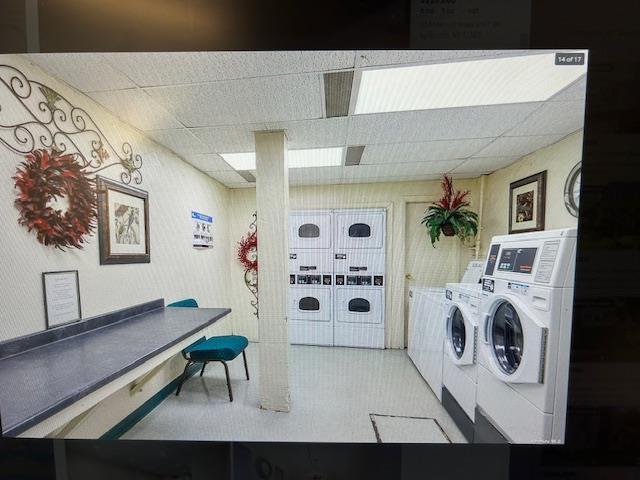 504 Merrick Rd Unit 4E, Lynbrook, NY 11563 - community laundry featuring separate washer and dryer and light flooring