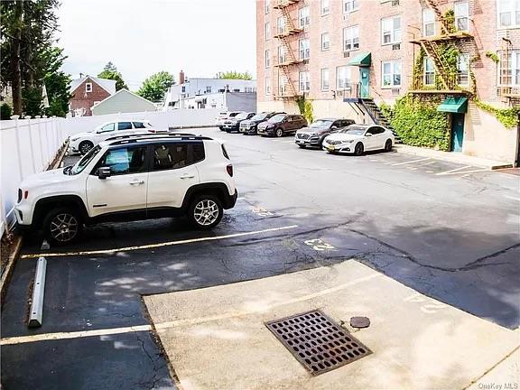 504 Merrick Rd Unit 4E, Lynbrook, NY 11563 - view of uncovered parking lot